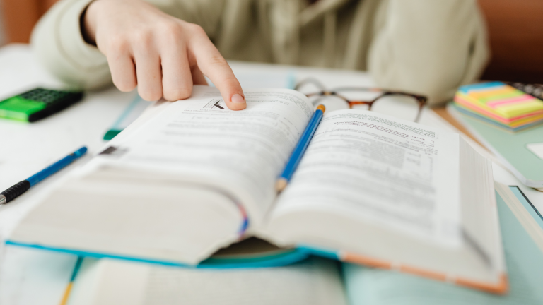 open book with finger tracking reading